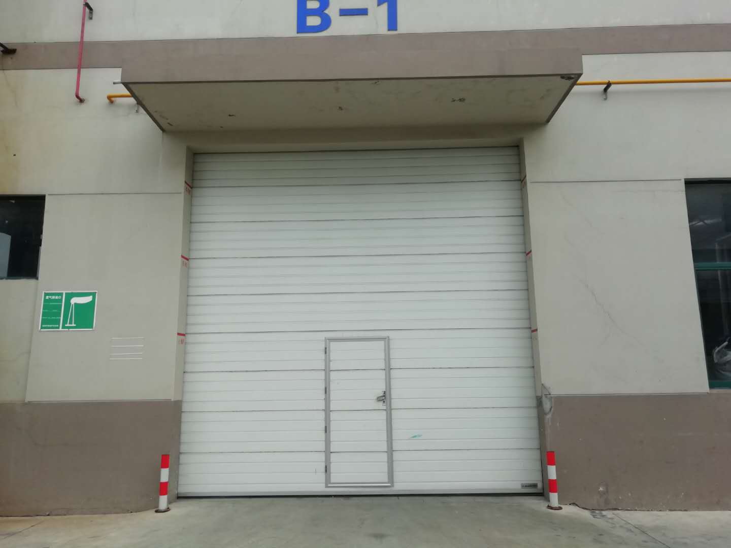 Industrial door with pedestrian gate